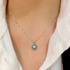 Collana con pendente in diamanti e smeraldi 