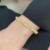 Bracciale rigido in argento dorato e zirconi 