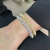 Bracciale rigido in argento dorato e zirconi 