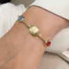 Bracciale in argento dorato e paste vitree colorate