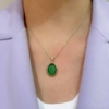 Collana con pendente in argento dorato e pasta vitrea verde 