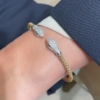Bracciale rigido in argento con teste di serpenti