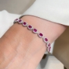 Bracciale tennis in argento con zirconi ovali rossi