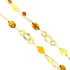 Collana lunga in argento dorato ed ambra