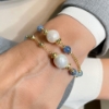 Bracciale in argento topazio azzurro e perle