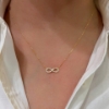 collana "infinito" in oro giallo e zirconi