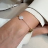 Bracciale in argento con saponette in zirconi e madreperla tonda